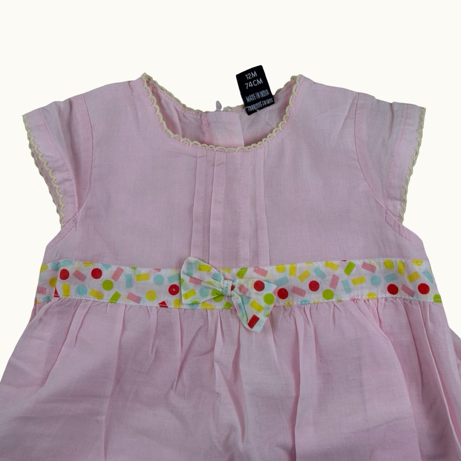 Robe rose avec noeud - 12 mois
